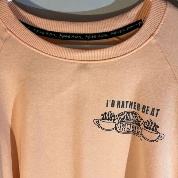 Friends Cropped Dolman Sleeve Central Perk Sweatshirt. Peach, Medium - Picture 2 of 9